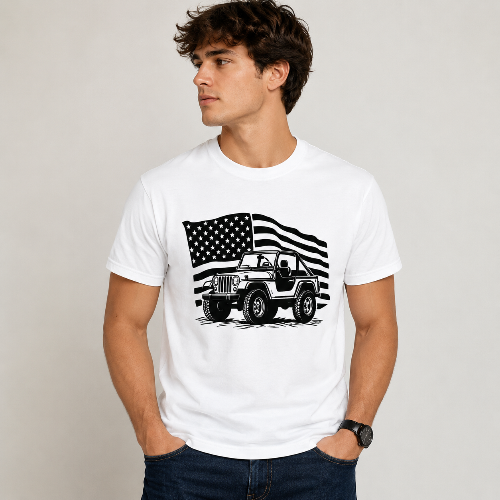 A man wearing a white crewneck t-shirt with a black graphic of a classic Jeep in front of a stylized American flag, paired with dark blue jeans against a light gray studio background.