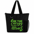 Black tote bag with green Be the Energy You Want to Attract quote, zipper, long straps, and side mesh pocket