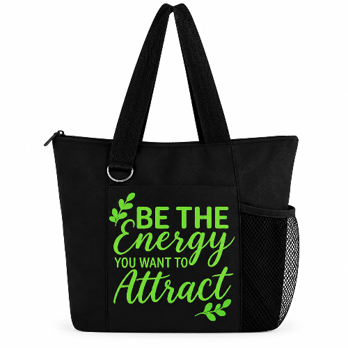 Black tote bag with green Be the Energy You Want to Attract quote, zipper, long straps, and side mesh pocket