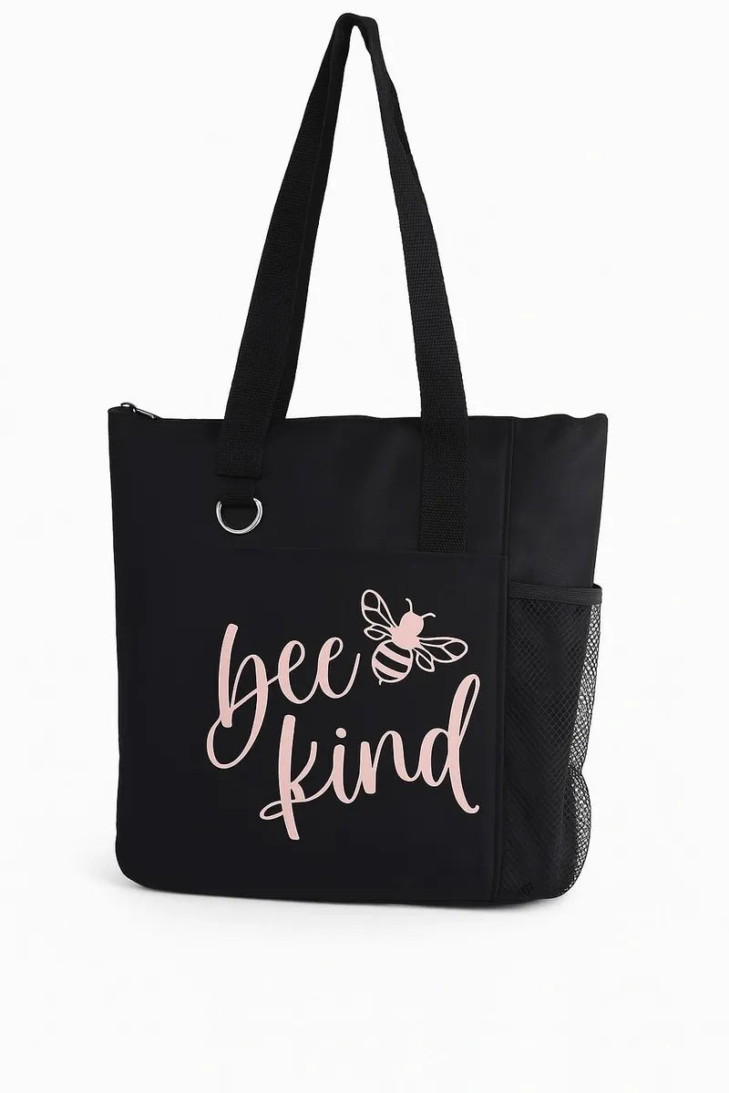 Black tote bag with white Bee Kind text and bee illustration, reusable fabric shoulder bag on white background
