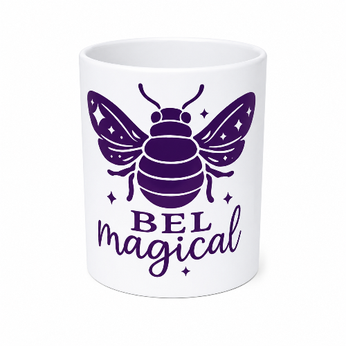 A white ceramic mug featuring a purple graphic of a bee with the text 'BEL magical' printed below it, set against a plain white background.