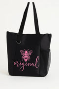 Black tote bag featuring a pink "Bee Original" design with a bee illustration. Inspirational reusable tote bag perfect for shopping, work, school, travel, books, groceries, and everyday essentials. Lightweight and durable shoulder bag designed to encourage individuality, confidence, creativity, and positive self-expression.