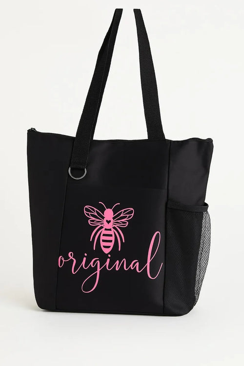 Black tote bag featuring a pink "Bee Original" design with a bee illustration. Inspirational reusable tote bag perfect for shopping, work, school, travel, books, groceries, and everyday essentials. Lightweight and durable shoulder bag designed to encourage individuality, confidence, creativity, and positive self-expression.