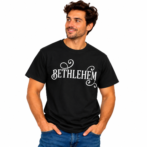 Man wearing a black Bethlehem graphic T-shirt with white decorative lettering