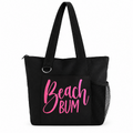 Black Beach Bum tote bag with pink lettering, shoulder straps, front pocket and side mesh pocket