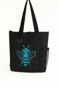 Black reusable tote bag featuring a teal bee graphic design on the front. Lightweight shoulder tote with long handles for comfortable carrying. Perfect for shopping, books, work, travel, errands, farmers markets, and everyday use. Stylish nature-inspired bee artwork adds a modern touch to this practical carryall bag. Ideal for women, students, teachers, gardeners, bee lovers, and eco-conscious shoppers seeking a fashionable and functional tote bag.