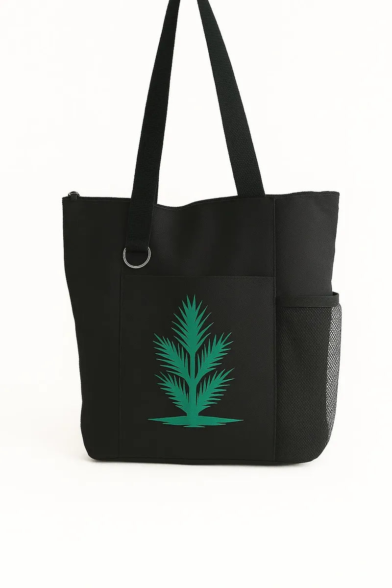 Black tote bag featuring a green botanical leaf design on the front. Lightweight reusable shoulder tote with long handles for comfortable carrying. Ideal for shopping, work, books, errands, travel, farmers markets, and everyday use. Nature-inspired tote bag with a minimalist botanical aesthetic that pairs easily with casual and modern outfits. Durable and practical carryall bag suitable for women, students, teachers, plant lovers, gardeners, and eco-conscious shoppers looking for a stylish everyday accessor