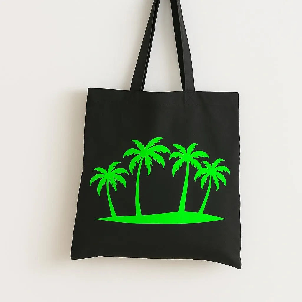 Black cotton tote bag with neon green palm tree design, reusable tropical shoulder bag for beach trips, shopping, travel, school, and summer everyday style.
