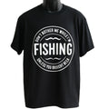 Black graphic t-shirt featuring a vintage circular fishing badge design with bold fishing text. Perfect for anglers, fishermen, outdoor enthusiasts, lake trips, fishing weekends, camping adventures, and casual everyday wear.