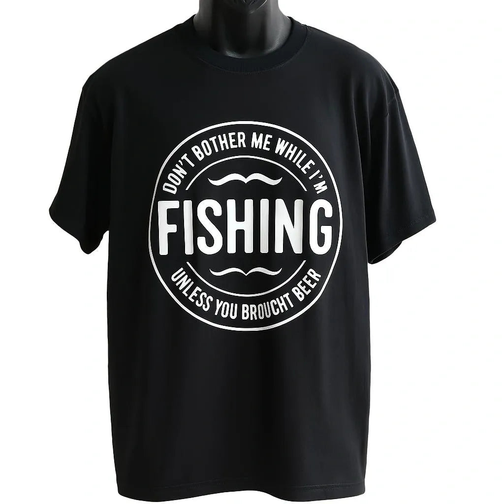 Black graphic t-shirt featuring a vintage circular fishing badge design with bold fishing text. Perfect for anglers, fishermen, outdoor enthusiasts, lake trips, fishing weekends, camping adventures, and casual everyday wear.