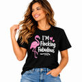 Black Flocking Fabulous T-shirt with pink flamingo graphic and white lettering styled with blue jeans.