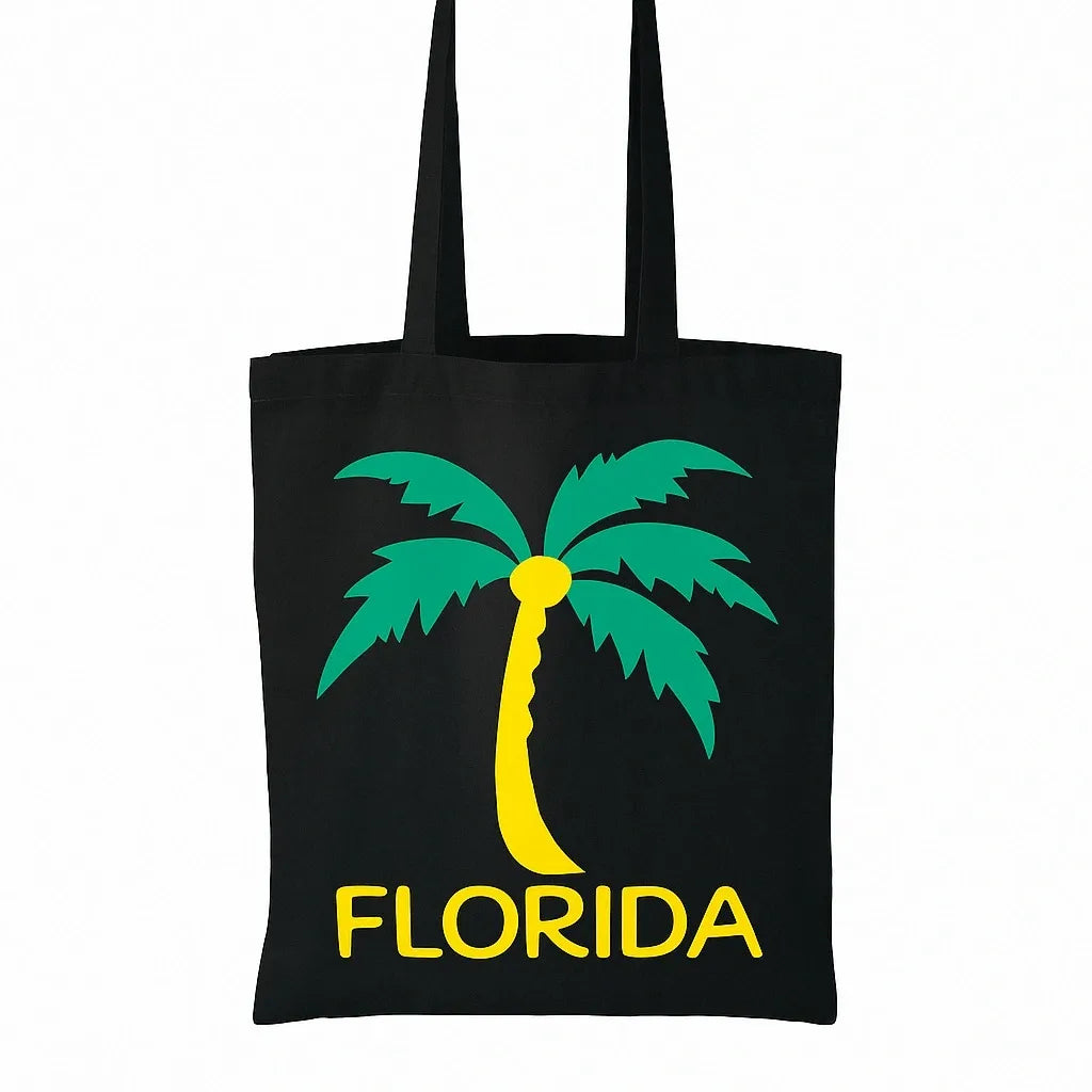 Black cotton tote bag with bright green and yellow Florida palm tree graphic design, reusable tropical beach shopper bag for travel, vacation, shopping, school, summer outings, and everyday carry by LB AND SK DESIGN SHOP