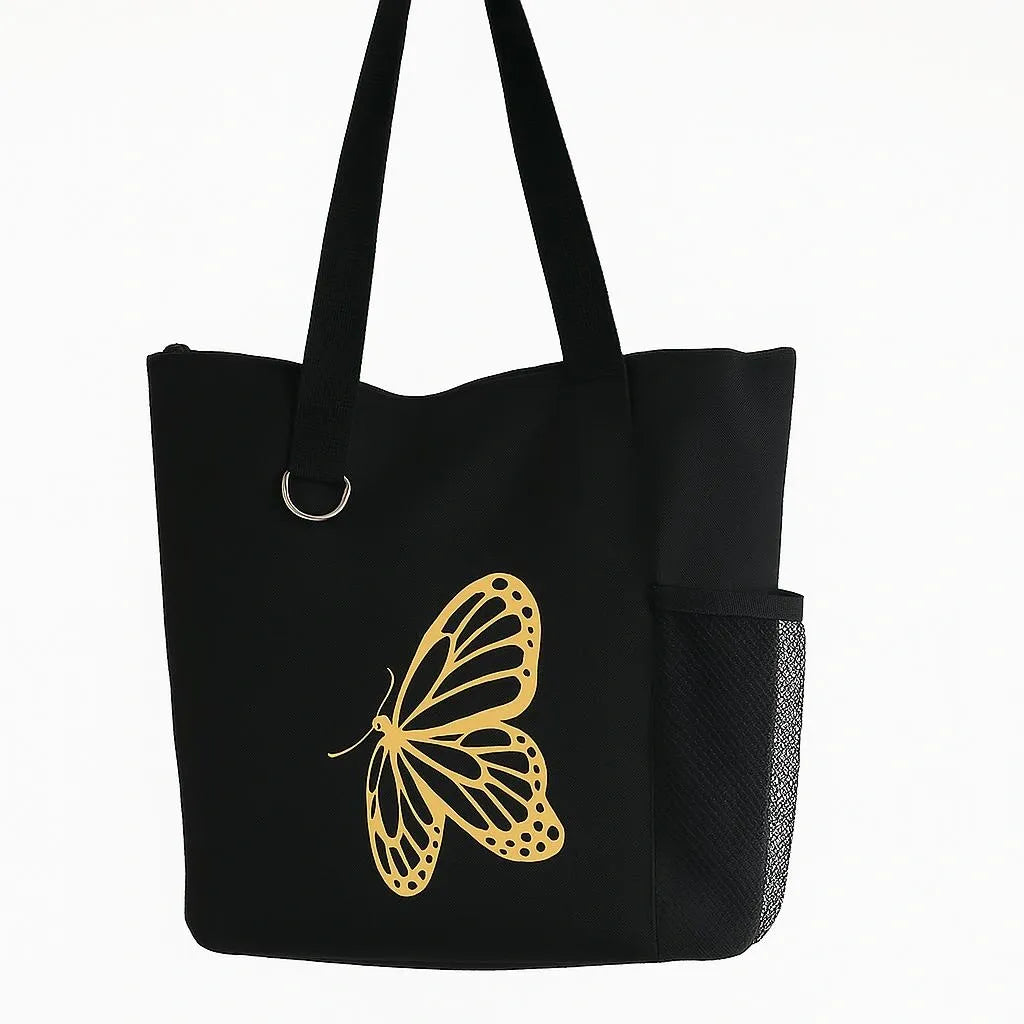 Black tote bag with elegant gold butterfly design, reusable everyday shoulder tote bag for shopping, travel, work, books, groceries, and daily essentials