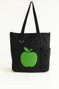 Black tote bag with bright green apple graphic design, reusable shoulder tote bag for shopping, work, school, travel, books, groceries, and everyday essentials