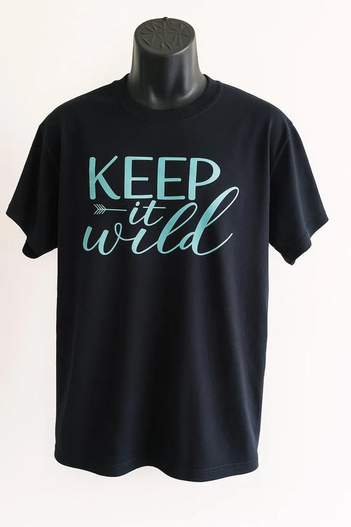 Black graphic t shirt featuring the phrase Keep Wild in bold stylish lettering, celebrating freedom, adventure, nature, and independent living.