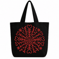 Black cotton tote bag featuring a red heart, floral, and kindness-inspired snowflake design on a white background.