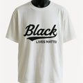 White graphic t-shirt featuring a bold "Black Lives Matter" typography design in black lettering, unisex statement tee promoting unity, equality, and awareness.