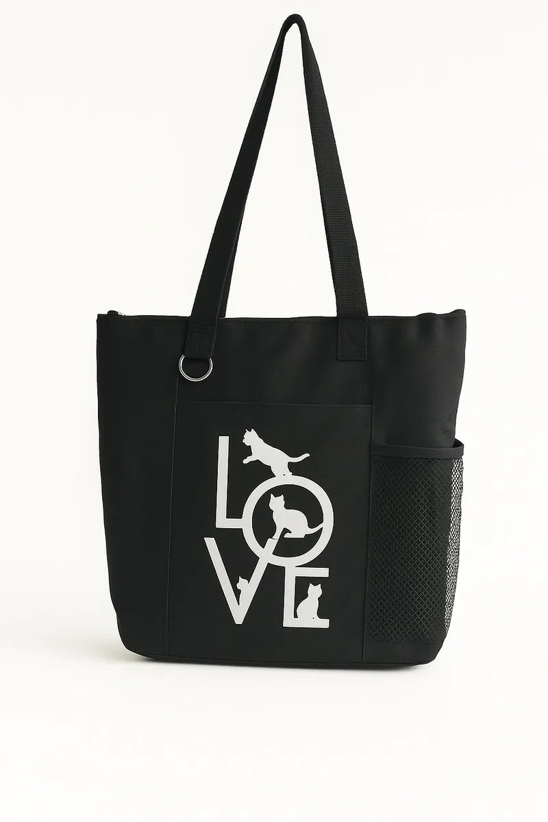 Black tote bag featuring a white LOVE script design on the front. Lightweight reusable shoulder tote with long handles for comfortable carrying. Ideal for shopping, work, books, errands, travel, school, gifts, and everyday use. Simple minimalist fashion accessory with a modern black and white design that pairs easily with casual outfits. Durable tote bag suitable for women, teens, students, teachers, and anyone looking for a stylish and practical everyday carry bag.