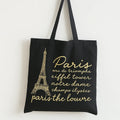 Shop the Black Paris Eiffel Tower Tote Bag with elegant gold Paris artwork on durable cotton. Perfect for shopping, travel, school, and stylish everyday use.