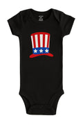 Black patriotic baby bodysuit with red white and blue USA hat graphic soft cotton infant outfit for Fourth of July summer holiday and Independence Day baby celebrations
