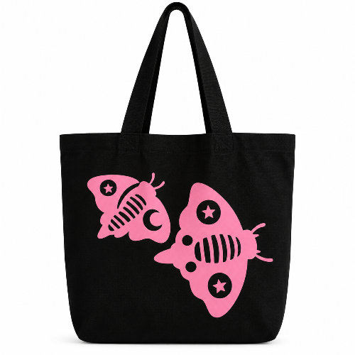 Black cotton tote bag featuring two bold pink fish designs on a clean white background.