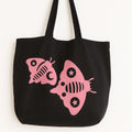 Black cotton tote bag with pink fish graphic design, reusable shoulder tote for beach trips, shopping, travel, ocean lovers, summer style, everyday carry bag with cute tropical fish artwork and durable fabric straps