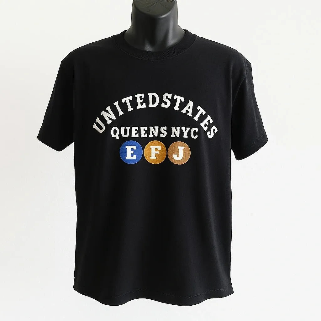 Black graphic t shirt featuring a Queens NYC inspired design with bold lettering celebrating New York City culture, borough pride, and urban streetwear style.