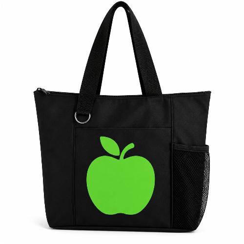 Black reusable tote bag with bright green apple graphic, long handles, zipper closure, front pocket, and side mesh pocket.