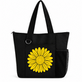 Black reusable tote bag featuring a large yellow sunflower graphic, long shoulder straps, zipper closure, front pocket, silver D-ring, and side mesh pocket.