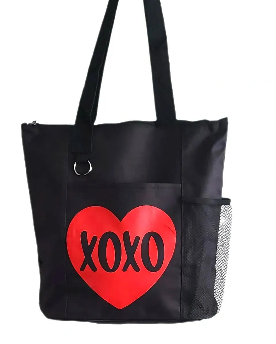 Black tote bag featuring a bold red heart with XOXO lettering design. Reusable shoulder tote bag for shopping, work, school, travel, books, groceries, and everyday errands. Lightweight and durable carryall with comfortable straps and a fun love-themed graphic. Perfect gift for Valentine's Day, anniversaries, girlfriends, wives, friends, and anyone who loves romantic accessories.