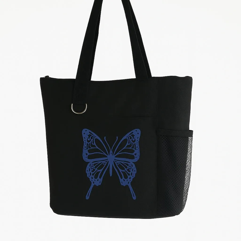 Black reusable tote bag featuring a blue butterfly design, lightweight shoulder tote for shopping, travel, books, groceries, work, and everyday carry