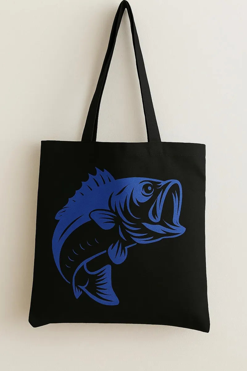 Black cotton tote bag with blue fish graphic design, reusable fishing and ocean inspired shoulder bag for shopping, beach trips, travel, school, and outdoor style.