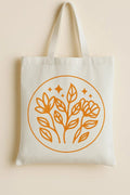 Minimalist botanical floral line art tote bag with warm earthy orange plant design on reusable canvas shopping bag for everyday use, books, errands, and eco-friendly style.