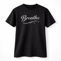 Black unisex graphic T shirt featuring the word Breathe in elegant white script lettering with a clean minimalist typography design.