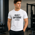 White Built Different Graphic T-shirt featuring the motivational phrase No Excuses in bold black typography. Premium unisex fitness and gym T-shirt.