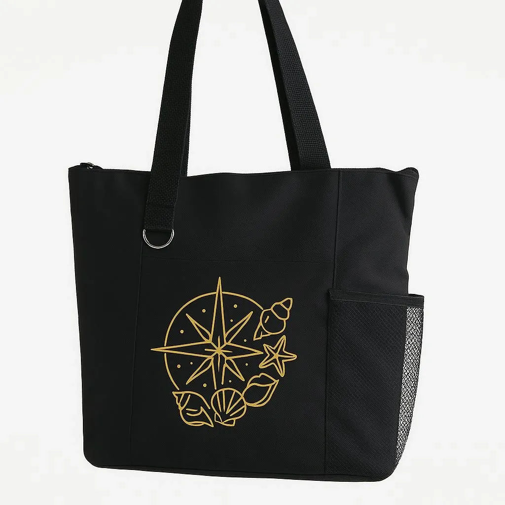 Black reusable tote bag featuring a gold compass design, travel inspired shoulder tote for shopping, books, groceries, vacations, adventures, and everyday carry