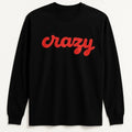 Black long sleeve graphic shirt featuring the word "Crazy" in bold red script lettering. Stylish statement apparel with minimalist typography design, perfect for casual wear, streetwear fashion, and expressive everyday outfits.
