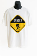 White graphic t-shirt featuring a bold yellow danger warning sign design with black lettering, stylish unisex streetwear graphic tee.