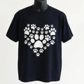 Dog Lover Paw Print Graphic T Shirt featuring a heart-shaped paw design. Comfortable unisex tee for dog moms, dog dads, pet lovers, and everyday casual wear.