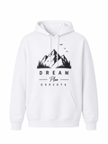 White unisex hoodie featuring Dream Explore Mountain landscape graphic with pine trees and birds, ideal for hiking, camping, travel, and outdoor lifestyle.