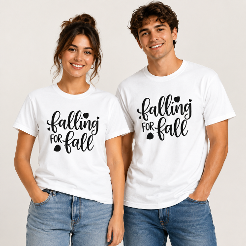 A man and a woman standing side by side wearing matching white graphic t-shirts with the black text 'falling FOR fall' and blue jeans, against a light off-white background.