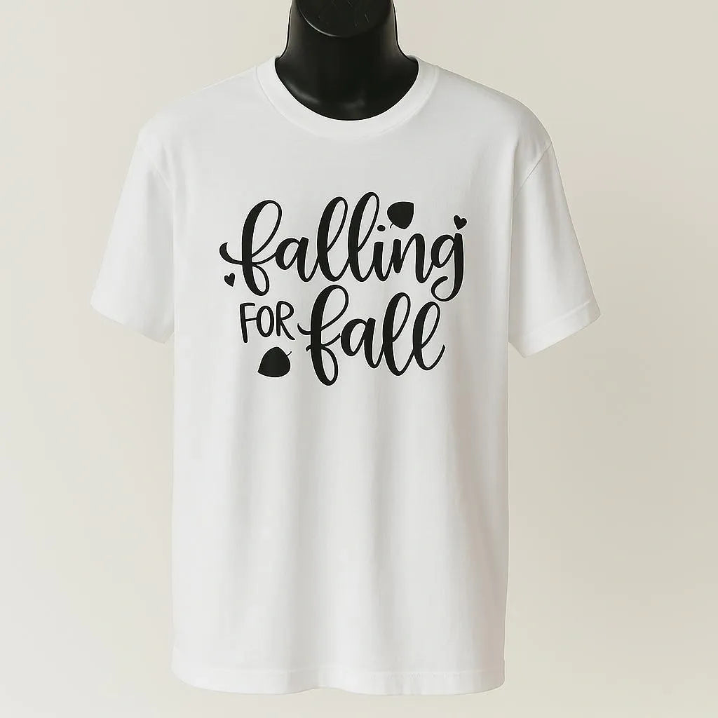 White graphic t-shirt featuring the phrase "Falling for Fall" in stylish seasonal typography. Cozy autumn-inspired unisex shirt perfect for pumpkin patch visits, fall festivals, sweater weather, Thanksgiving gatherings, and casual seasonal outfits.