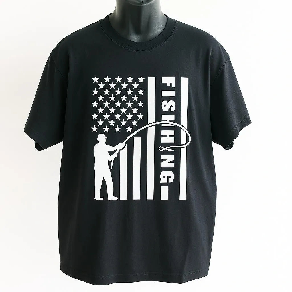 Black Fishing American Flag Graphic T Shirt featuring a fisherman casting a line across a distressed USA flag design. Patriotic fishing apparel for anglers and outdoor enthusiasts.