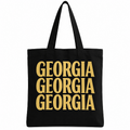 Black cotton tote bag with Georgia repeated three times in bold gold lettering.