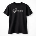 Black unisex graphic T shirt featuring the word Grace in elegant white script lettering with a clean minimalist typography design.