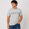 Male model wearing a heather gray R.O.C.K graphic T-shirt with black outlined lettering, styled casually with blue jeans.