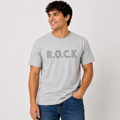 Male model wearing a heather gray R.O.C.K graphic T-shirt with black outlined lettering, styled casually with blue jeans.
