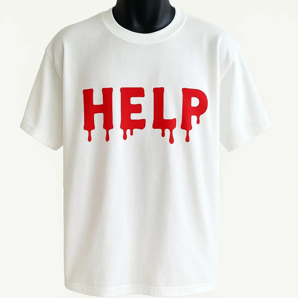 White graphic t-shirt featuring bold red "HELP" lettering with a dripping effect design. Statement graphic tee perfect for streetwear, casual outfits, everyday fashion, concerts, travel, and bold personal style. Soft and comfortable unisex t-shirt with eye-catching typography artwork.