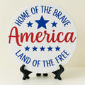 Round Happy Independence Day patriotic coaster featuring a red, white, and blue fireworks design. Perfect for Fourth of July celebrations, summer parties, BBQs, patriotic gatherings, and American-themed home decor.