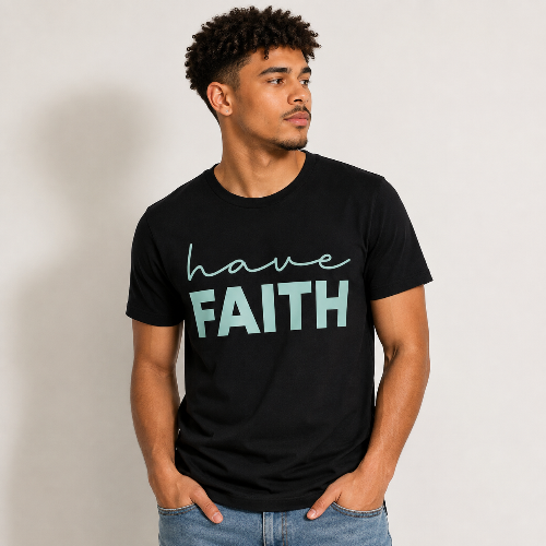 A man wearing a black crewneck t-shirt with the text 'have FAITH' printed on the chest in light teal, posed against a neutral light gray background.